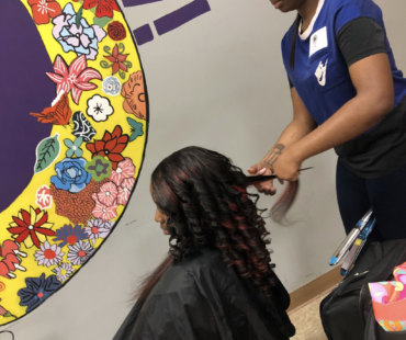 Volunteer Cutting Hair